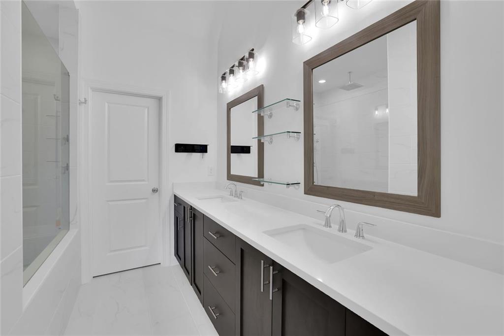 3106 Moor View Road Duluth, GA 30096 - Photo 38 of 57 a bathroom with a sink and a mirror