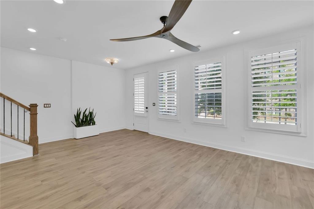 3106 Moor View Road Duluth, GA 30096 - Photo 7 of 57 a view of an empty room with a window and wooden floor
