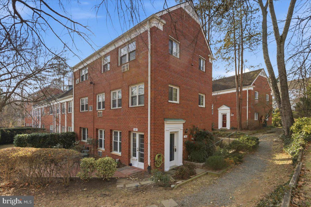 1737 Preston Road, Unit B Alexandria, VA 22302 - Photo 1 of 17 a front view of a building with a yard