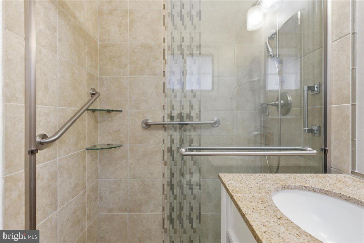 1737 Preston Road, Unit B Alexandria, VA 22302 - Photo 14 of 17 a bathroom with a granite countertop shower and a sink