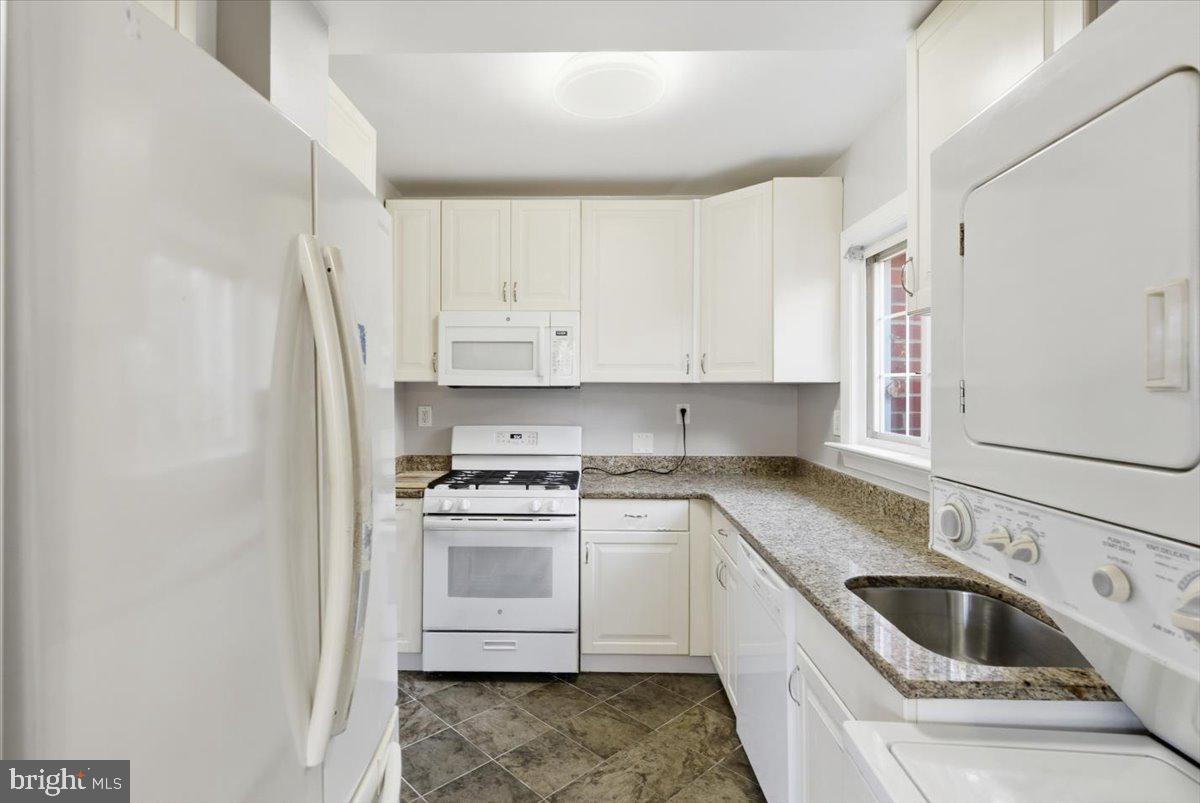 1737 Preston Road, Unit B Alexandria, VA 22302 - Photo 6 of 17 a kitchen with a sink stove top oven and cabinets