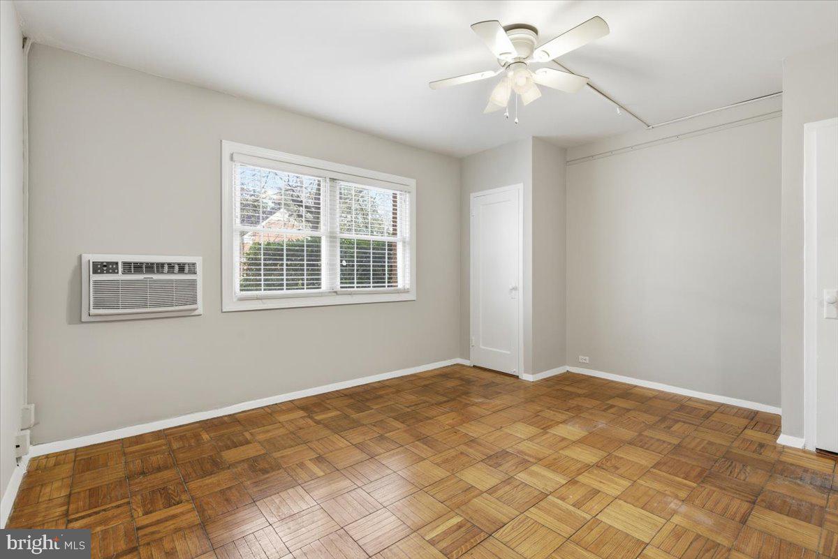 1737 Preston Road, Unit B Alexandria, VA 22302 - Photo 10 of 17 a view of a room with a window and a chandelier fan