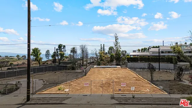 a view of a swimming pool with a table and chairs