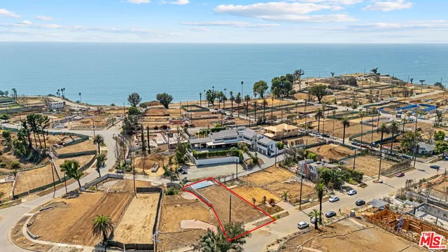 an aerial view of a building with parking space