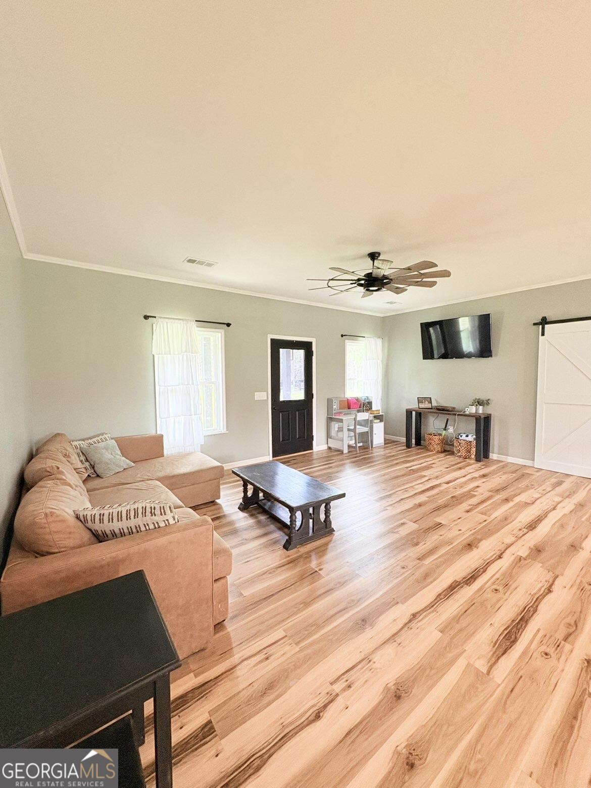 210 St Galilee Road Swainsboro, GA 30401 - Photo 7 of 18 a living room with furniture and flat screen tv