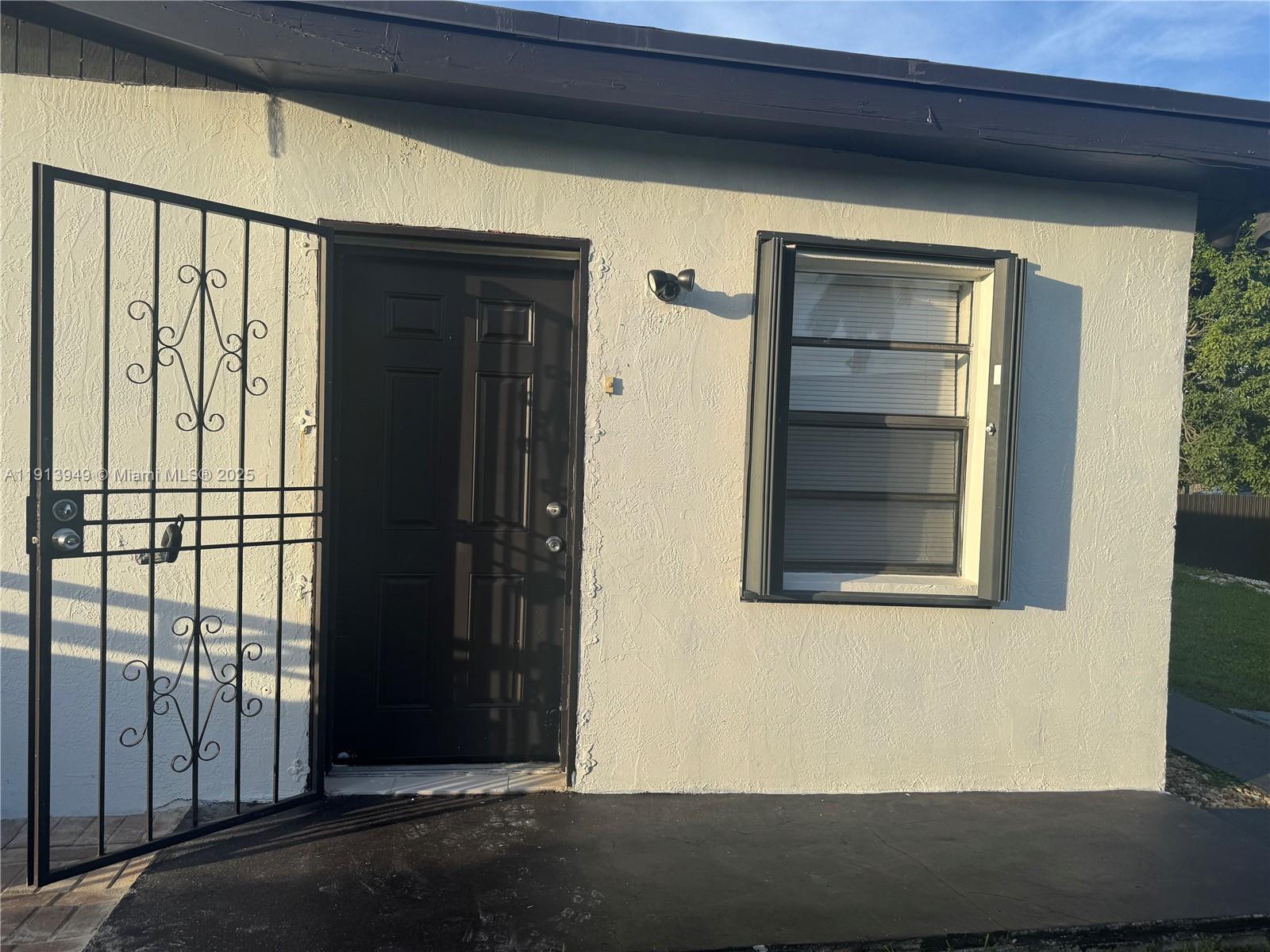 29523 Southwest 144th Court Homestead, FL 33033 - Photo 12 of 59 a view of an entrance of the house