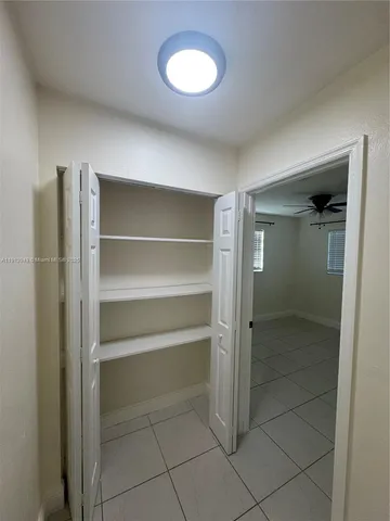 a view of a room with a large window