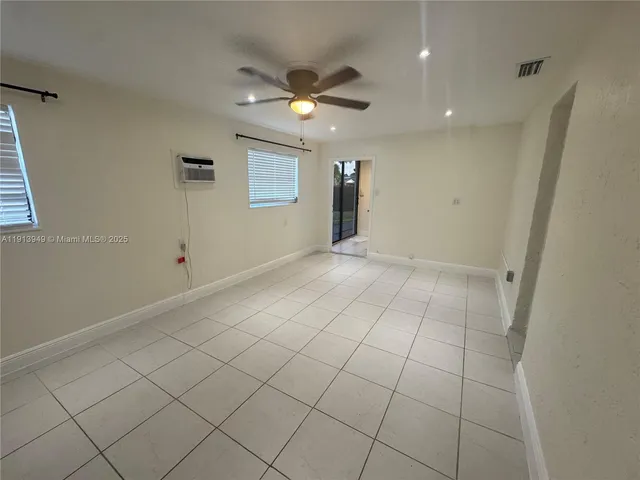 a bathroom with a sink a light fixture and a toilet