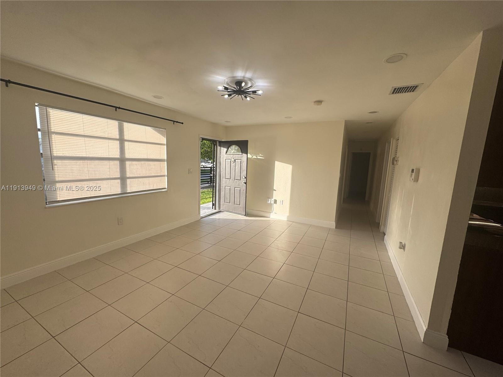 29523 Southwest 144th Court Homestead, FL 33033 - Photo 43 of 59 a view of an empty room with a window