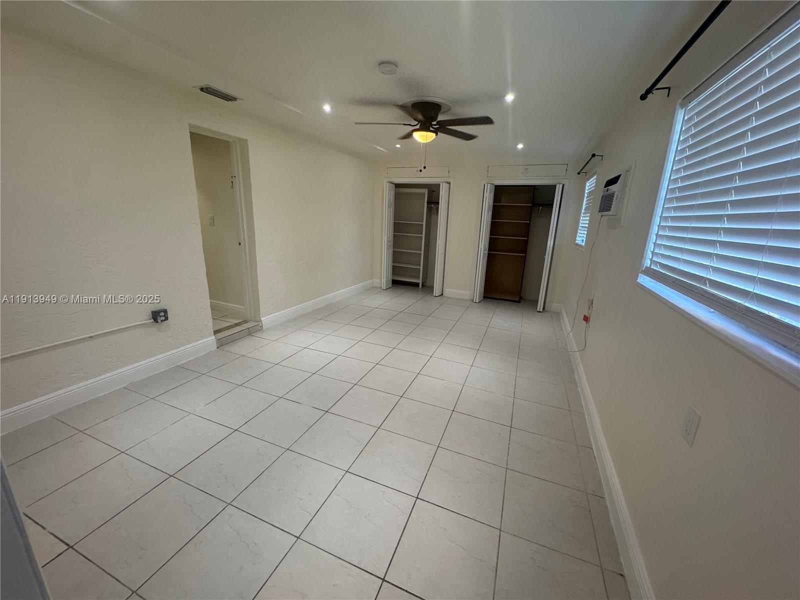 29523 Southwest 144th Court Homestead, FL 33033 - Photo 44 of 59 a view of an empty room with a fireplace