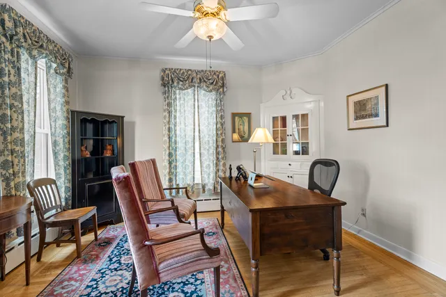 a dining room with furniture and window