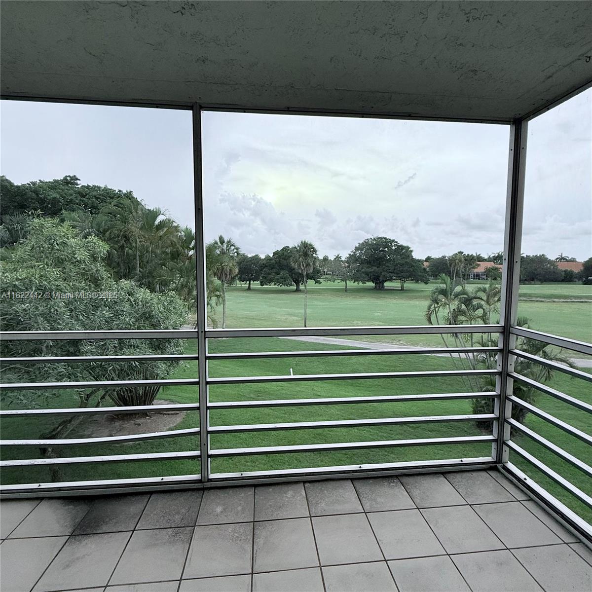 3980 Oaks Clubhouse Drive, Unit 302 Pompano Beach, FL 33069 - Photo 15 of 15 a view of outdoor space with a lake view