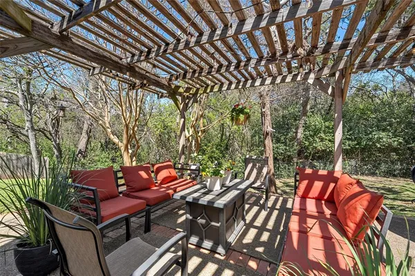 a outdoor sitting area with furniture and wooden floor