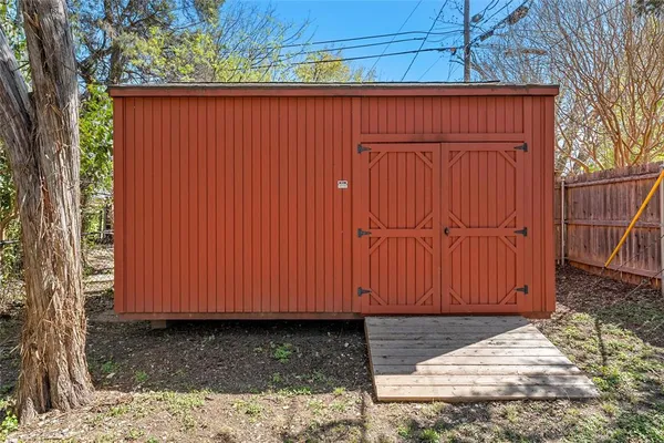 a wooden door in a backyard