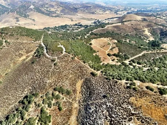 an aerial view of a highlighted house