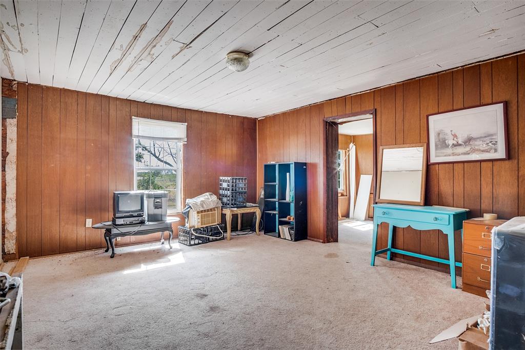 7165 County Road 1232 Godley, TX 76044 - Photo 13 of 17 a bedroom with furniture and a large window