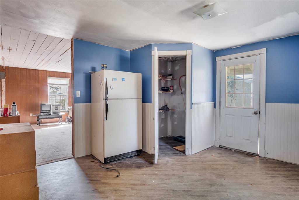 7165 County Road 1232 Godley, TX 76044 - Photo 5 of 17 a refrigerator freezer sitting in a kitchen with a refrigerator