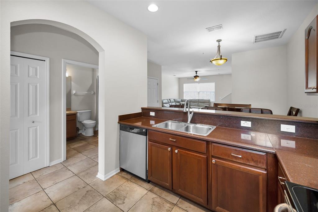 5628 Sea Turtle Court New Port Richey, FL 34652 - Photo 14 of 99 a kitchen with a sink and cabinets