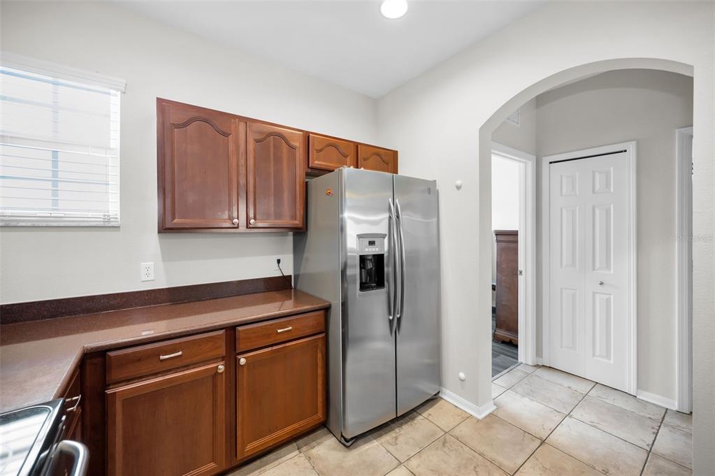 5628 Sea Turtle Court New Port Richey, FL 34652 - Photo 15 of 99 a kitchen with stainless steel appliances granite countertop a refrigerator and a sink