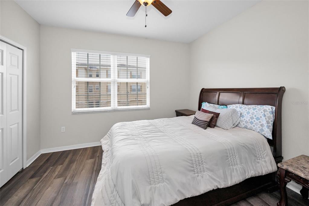 5628 Sea Turtle Court New Port Richey, FL 34652 - Photo 16 of 99 a bedroom with a bed and a window