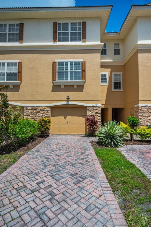 5628 Sea Turtle Court New Port Richey, FL 34652 - Photo 2 of 99 a front view of a house with a yard