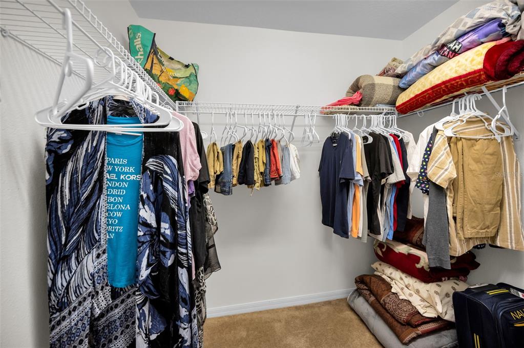 5628 Sea Turtle Court New Port Richey, FL 34652 - Photo 30 of 99 a view of walk in closet with clothes and shoes