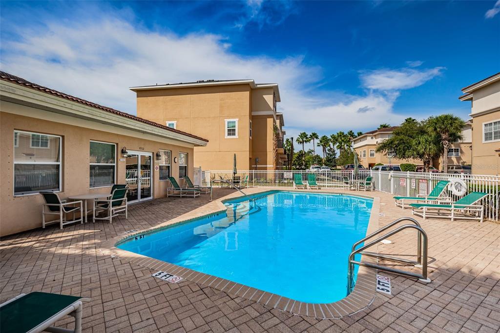 5628 Sea Turtle Court New Port Richey, FL 34652 - Photo 60 of 99 a view of a swimming pool with a lounge chair
