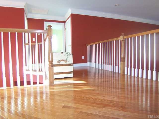 11715 Broadfield Court Raleigh, NC 27617 - Photo 9 of 12 As you reach the top of the stairs, this is your view of the second level. It is open and bright with oak flooring laid on the diagonal.