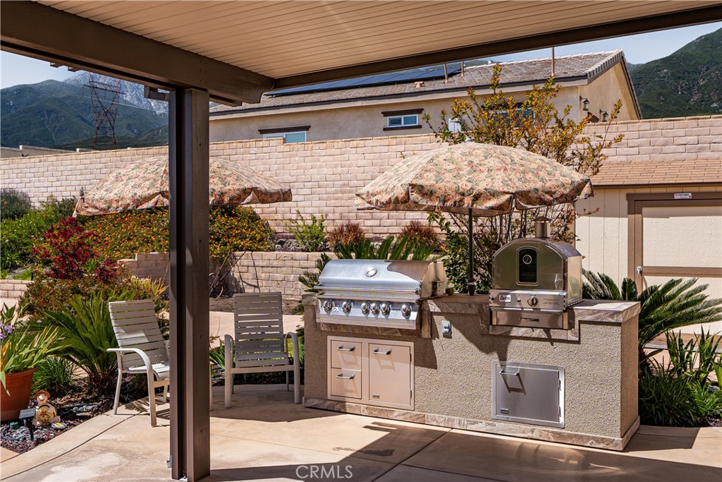 4976 Golden Ridge Place Rancho Cucamonga, CA 91739 - Photo 44 of 56 BBQ kitchen island with pizza oven