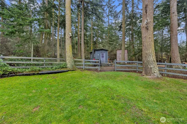 a view of a table and chairs in the garden