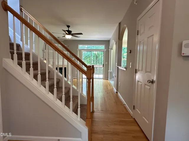 a view of entryway with wooden floor
