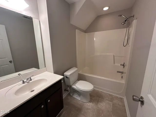 a view of a hallway with wooden floor and stairs
