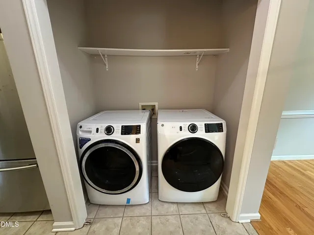 a view of a two chairs in the balcony