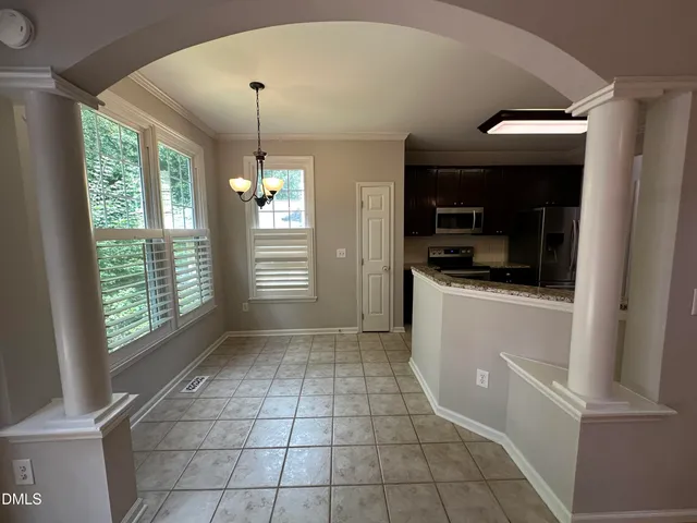 a view of a kitchen with a sink dishwasher and a refrigerator