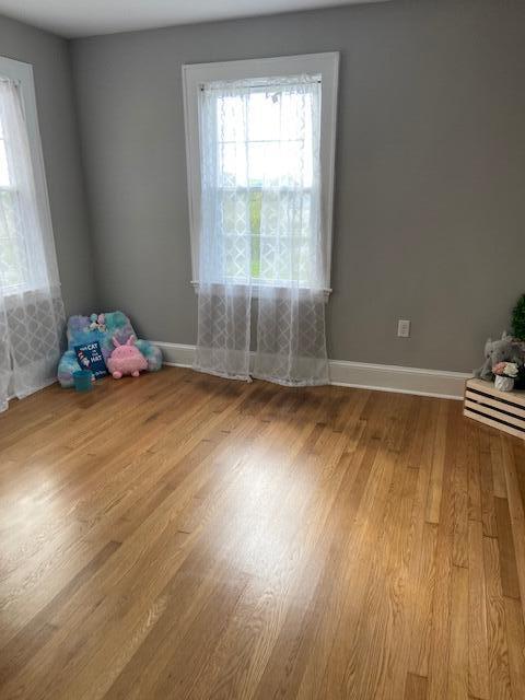 1116 Sandy Level Road Goodview, VA 24095 - Photo 14 of 22 a room with wooden floor and a window