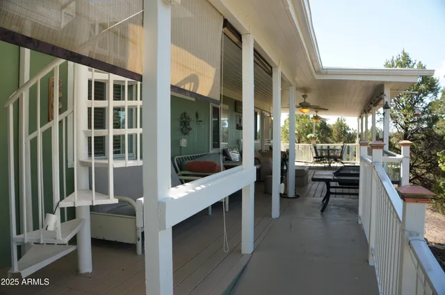 a view of a house with yard and sitting area