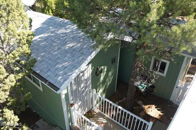 a view of a house with a tree