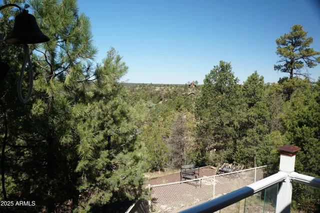 a view of a house with a yard covered in snow