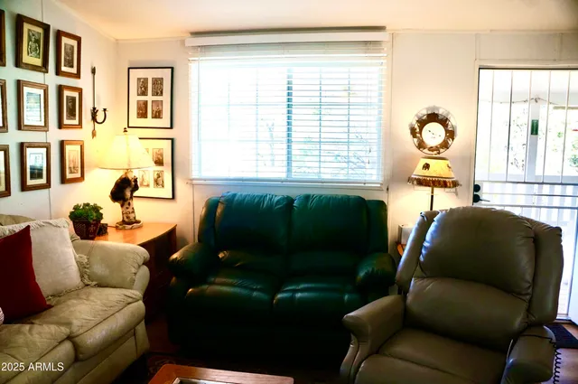 a kitchen with stainless steel appliances granite countertop a refrigerator a sink and a stove