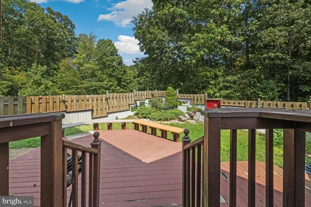 an outdoor space with furniture and garden