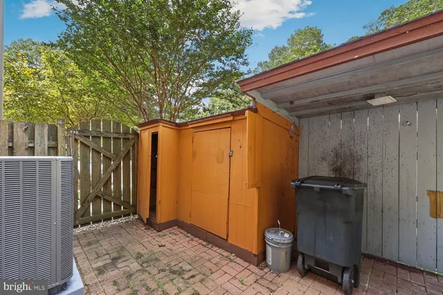 a swimming pool with outdoor seating and yard