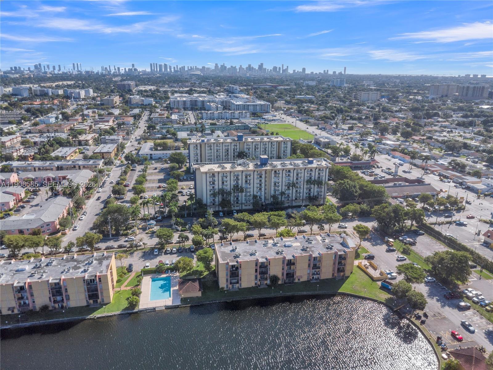 4709 Northwest 7th Street, Unit 2049 Miami, FL 33126 - Photo 17 of 51 a view of a couches with wooden fence