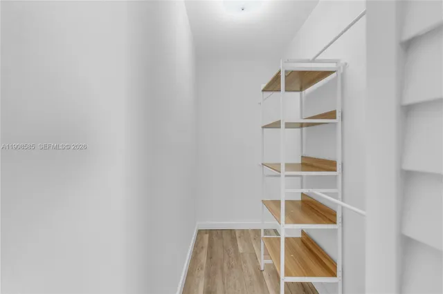 a view of balcony with wooden floor and fence