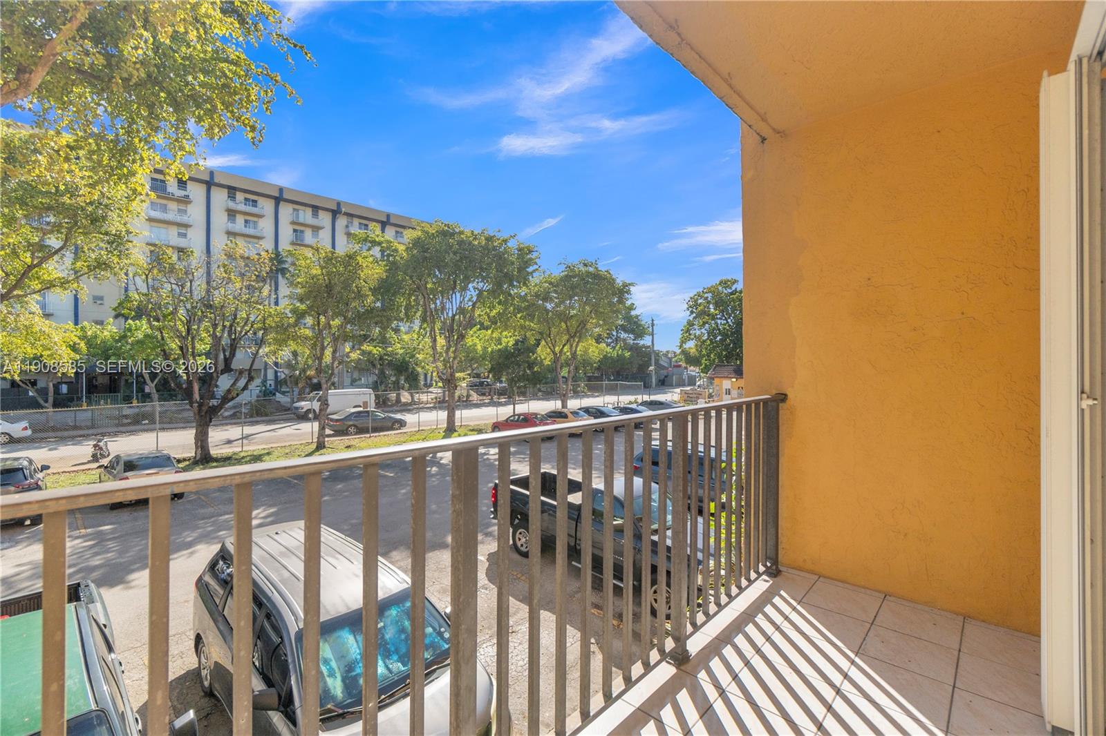 4709 Northwest 7th Street, Unit 2049 Miami, FL 33126 - Photo 28 of 51 a view of balcony with wooden floor and fence