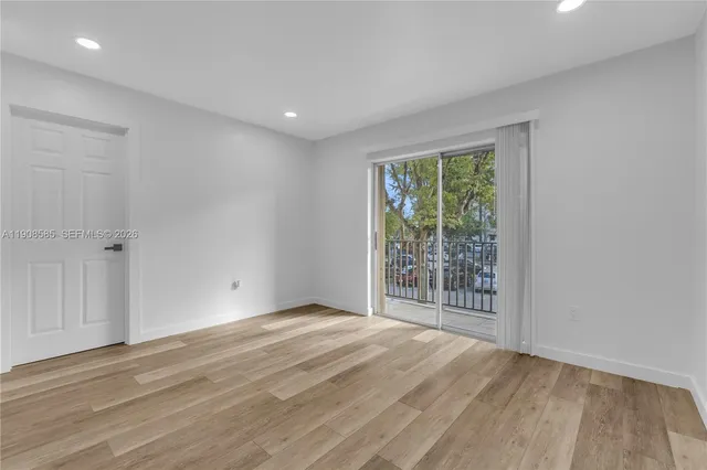 a bathroom with a granite countertop toilet and a shower