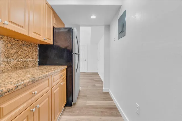 a view of a kitchen cabinets and wooden floor