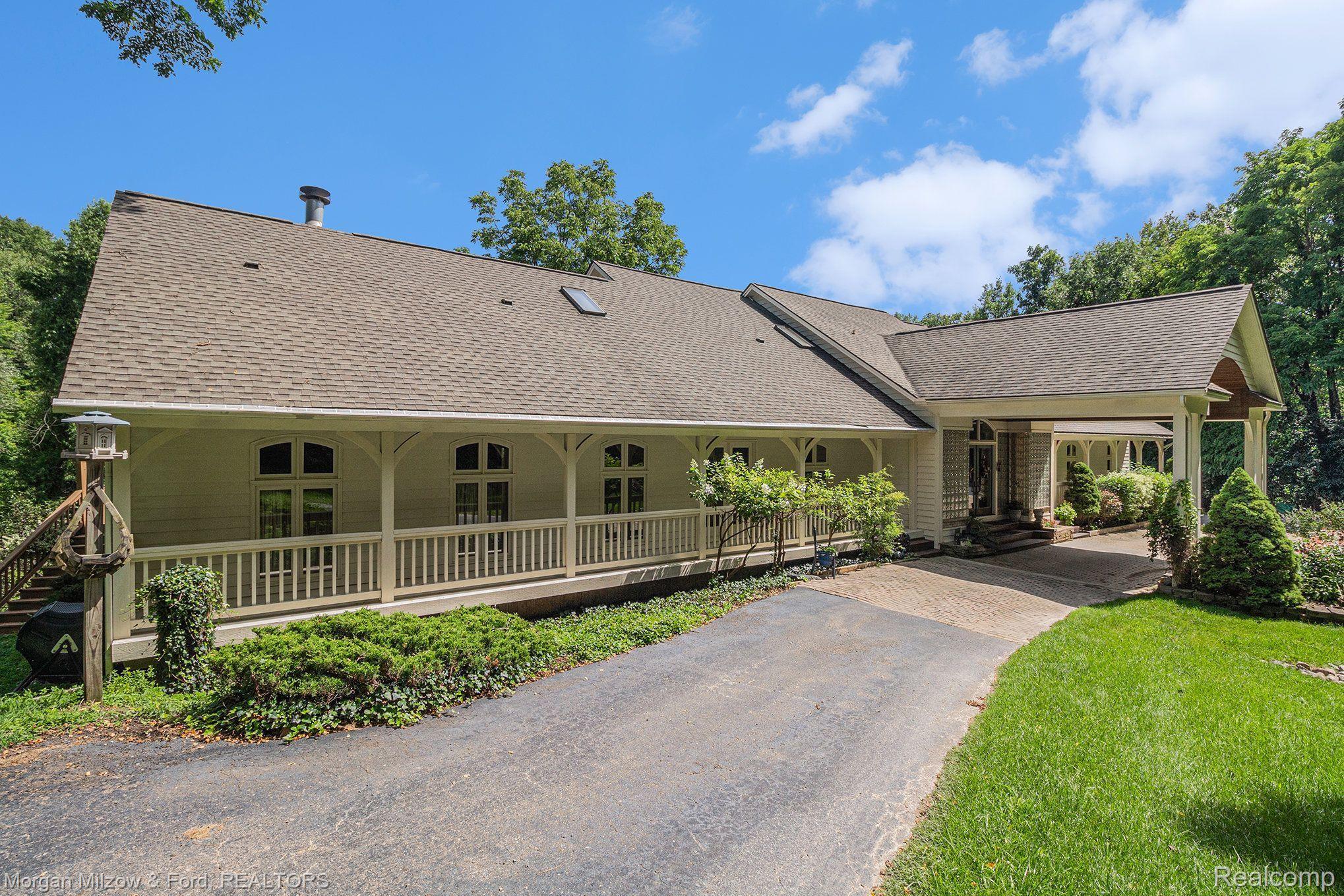 7979 Foster Road Clarkston, MI 48346 - Photo 1 of 45 Front elevation accented with a charming porch