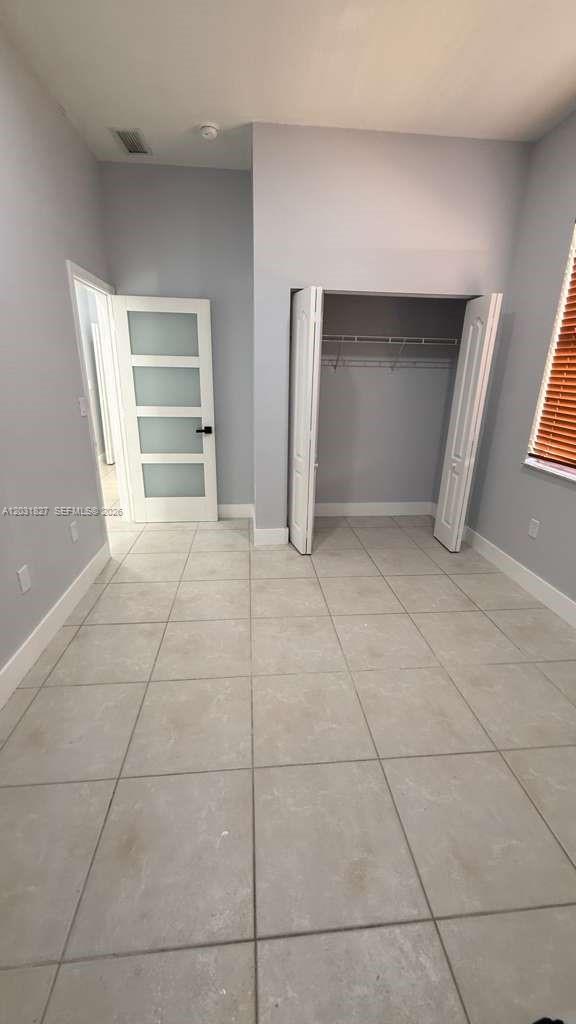 2120 Northeast 37th Road, Unit 1 Homestead, FL 33033 - Photo 22 of 30 a view of an empty room with a window