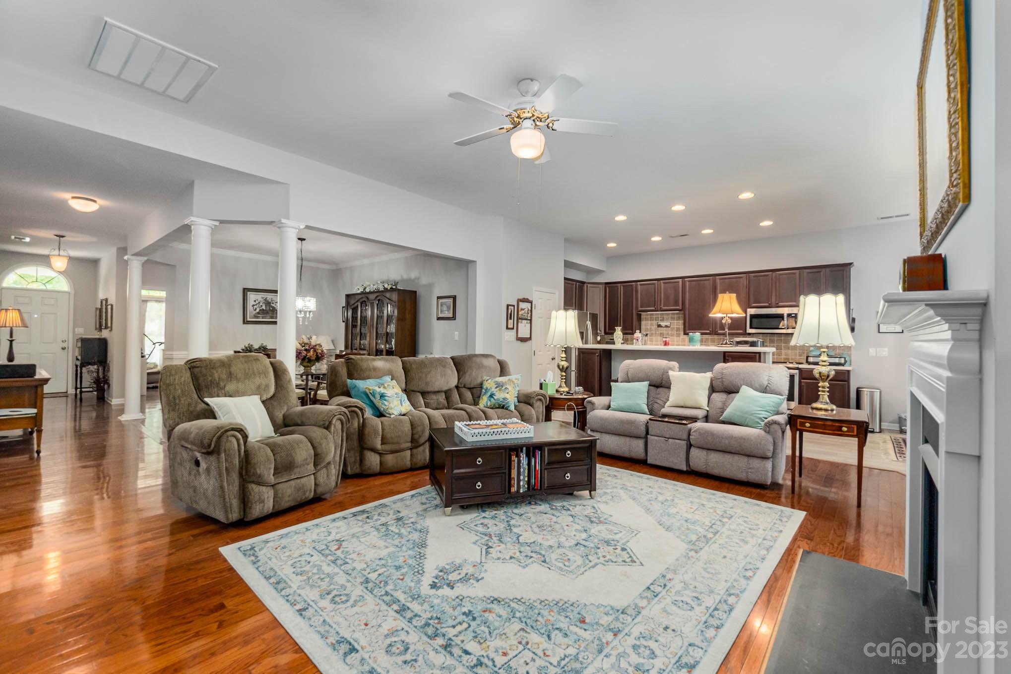 112 Pine Lake Drive Monroe, NC 28110 - Photo 11 of 37 a living room with furniture kitchen view and a table