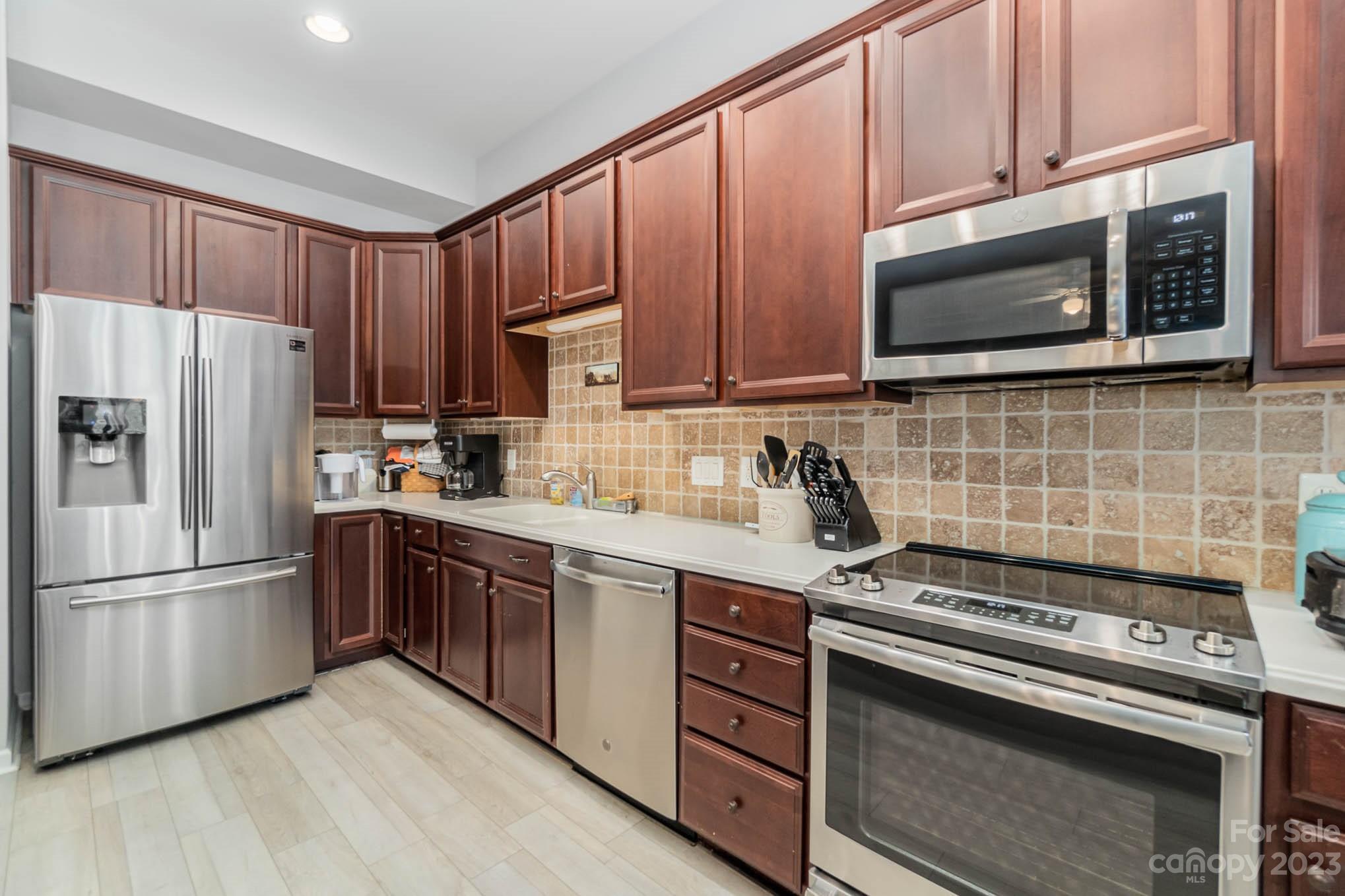 112 Pine Lake Drive Monroe, NC 28110 - Photo 14 of 37 a kitchen with a stove microwave and refrigerator